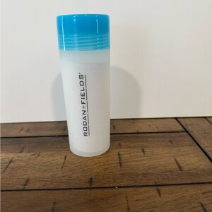Rodan + Fields Frosted Cleaning Bottle with Bright Blue Cap